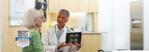 Doctor displaying scans to patient